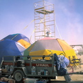 Our dome, the village's large event dome, and the village's scaffold.