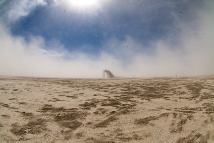 Giant slide on the open playa. You can see the scale of it by the roup of people to the right of it. My sensor was covered in grime by this point, since I was still shooting digital in 2009.